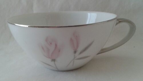 A bowl with pink flowers on it