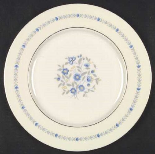 A white plate with blue flowers on it.