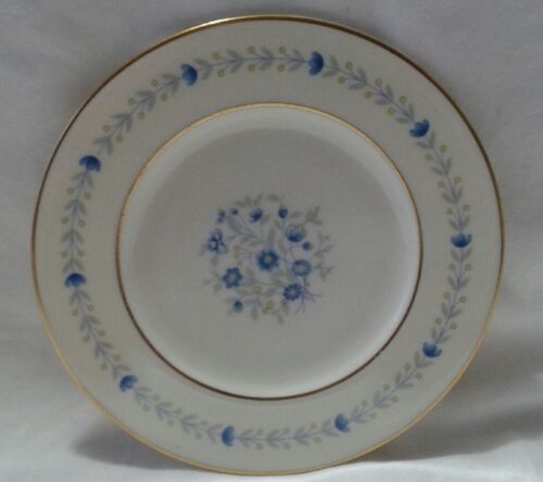 A white plate with blue flowers on it