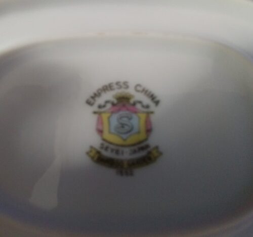 A close up of the crest on a plate