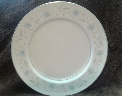 A white plate with blue flowers on it
