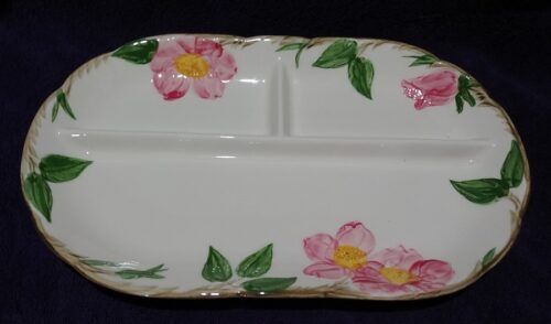 A white plate with pink flowers on it