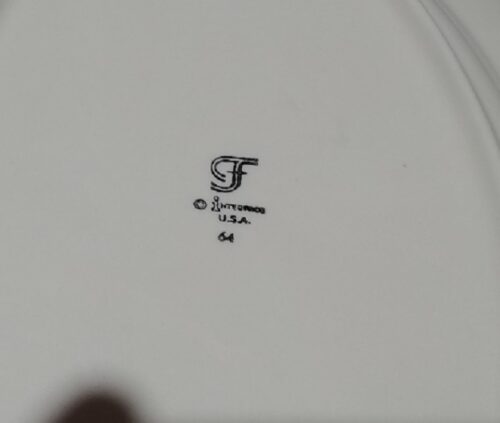 A close up of the letter f on a plate