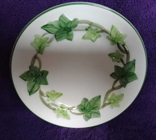 A plate with ivy leaves on it