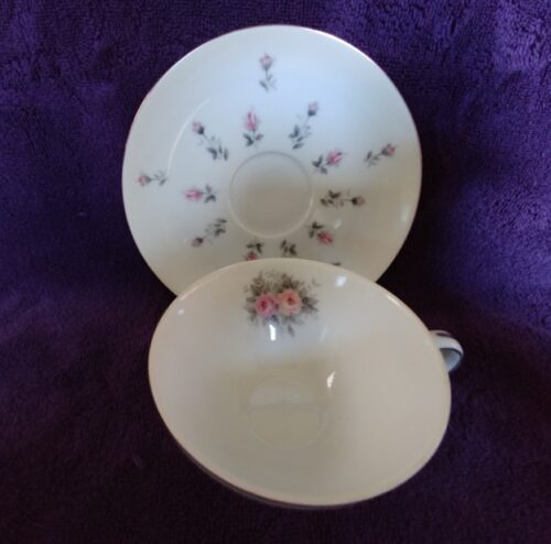 A cup and saucer with flowers on it.