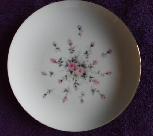A white plate with pink flowers on it