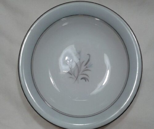 A bowl with a gray and white design on it.