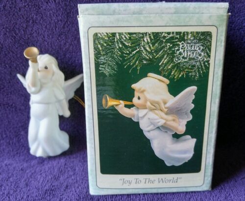 A figurine of an angel playing the trumpet.