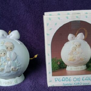 A ceramic ball with two babies in it