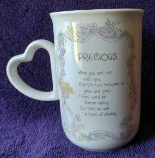 A mug with the words " precious " written on it.