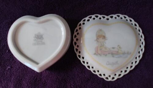 Two heart shaped dishes with a picture of girl on them.
