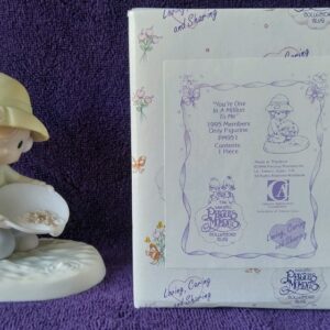A picture of someone 's autograph book and figurine.