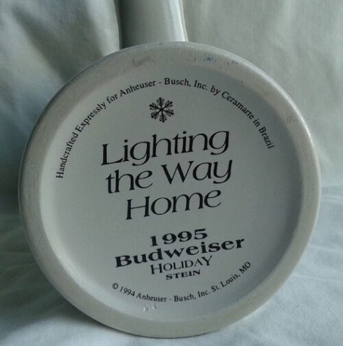 A white plate with the words " lighting the way home 1 9 0 5 budweiser holiday time ".