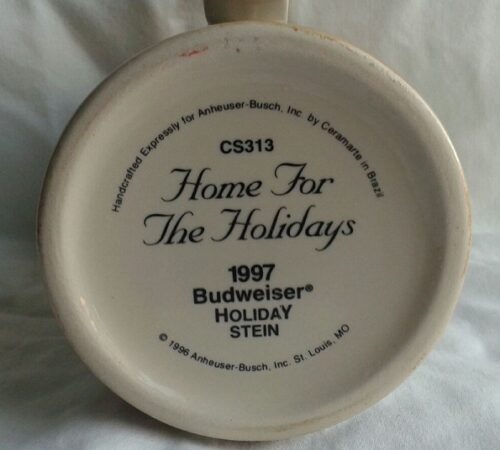 A white bowl with the words " home for the holidays 1 9 9 7 budweiser holiday stein ".