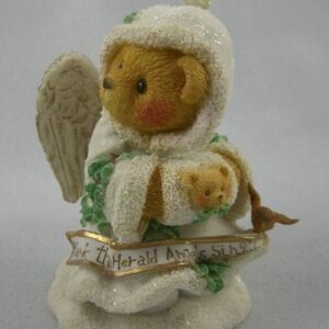 A teddy bear wearing an angel outfit holding a teddy bear.