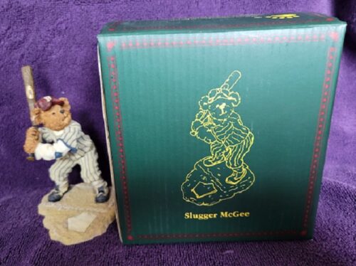 A figurine of a baseball player and a box.