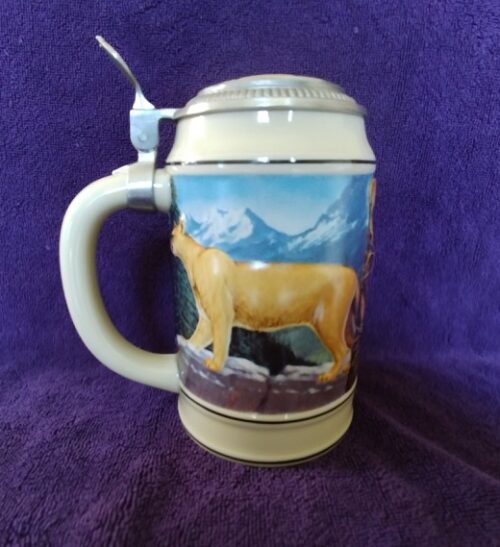 A beer mug with a picture of a bear on it.