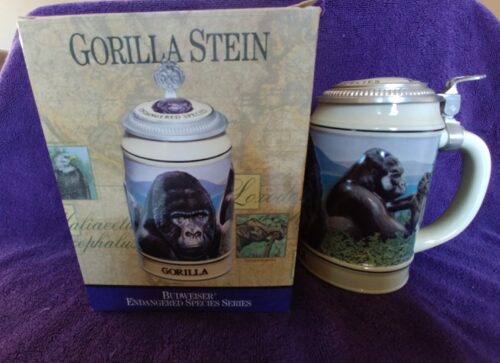 A gorilla stein is sitting next to a box.