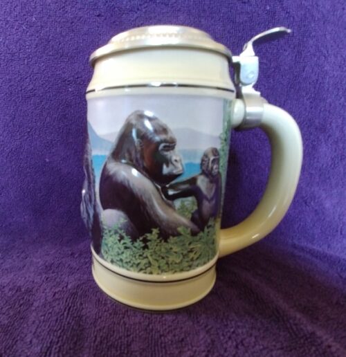 A beer mug with two monkeys on it