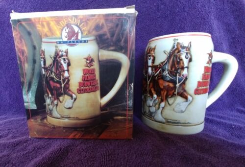 A mug with two horses on it and the words " the horse is ready to ride ".