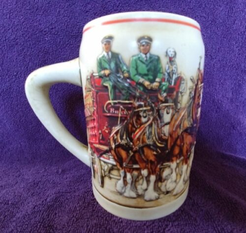 A mug with two men on it and horses.