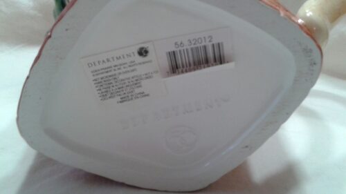 A white container with a bar code on it.