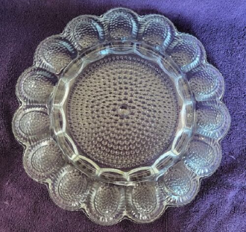 A glass plate with many holes on it