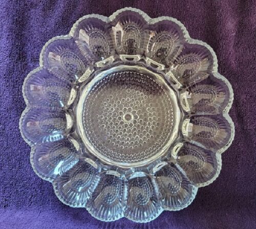 A clear glass plate with a pattern on it.