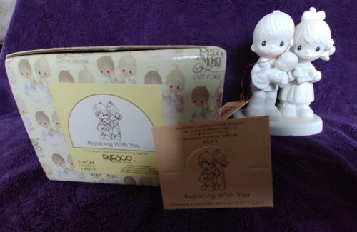 A box of the original baby figurine and its packaging.
