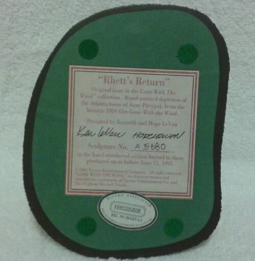 A green plaque with the name " neely 's bakery ".