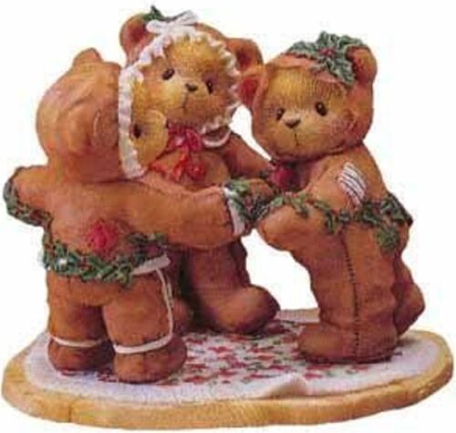 A group of three teddy bears standing on top of a floor.