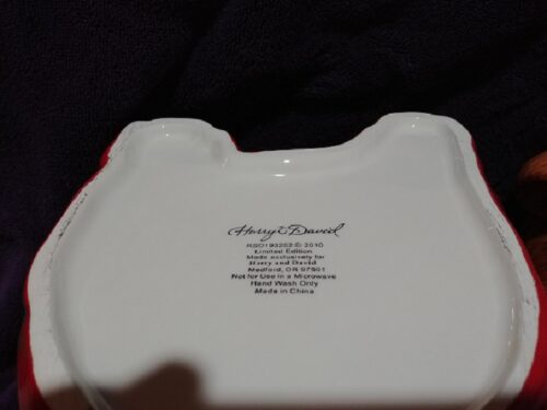 A white plate with the words " always blessed ".