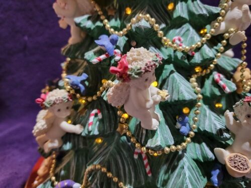 A close up of the christmas tree with angels