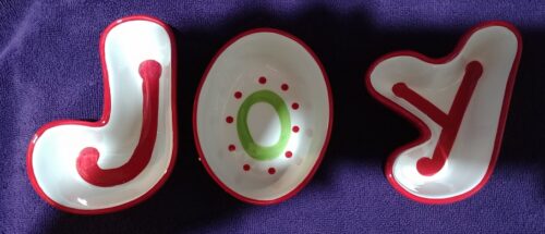 A close up of the word joy with bowls