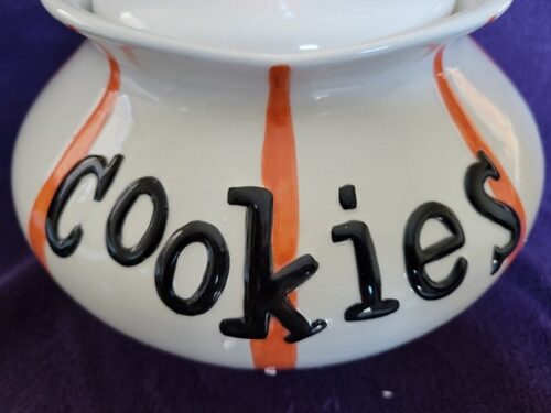 A close up of the word cookies on a bowl