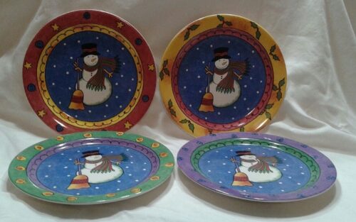 Sango Sweet Shoppe Christmas Salad Plates Four plates with a snowman on them.