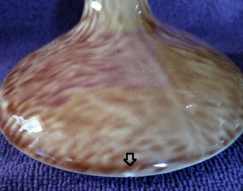 A close up of the bottom of a vase